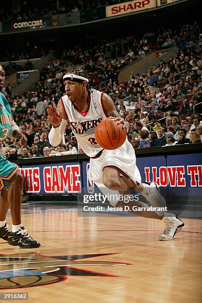 Allen Iverson of the Philadelphia 76ers drives to the net against Darrell Armstrong of the New Orleans Hornets January 30, 2004 at the Wachovia...
