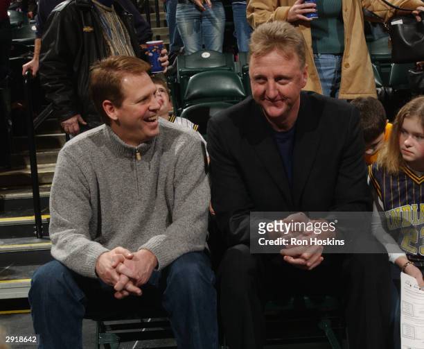 Former Boston Celtics teammates and now NBA team executives Danny Ainge, left, with the Celtics and Larry Bird with the Indiana Pacers chat during...