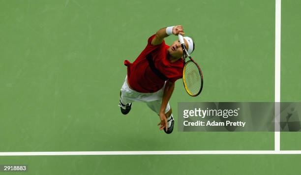 Roger Federer of Switzerland serves against Marat Safin of Russia during the Mens Singles Final during day fourteen of the Australian Open Grand Slam...