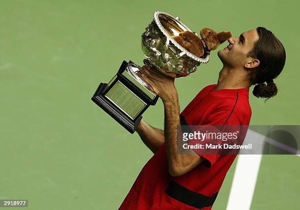 Roger Federer of Switzerland celebrates defeating Marat Safin of Russia during the Mens Singles Final on day fourteen of the Australian Open Grand...