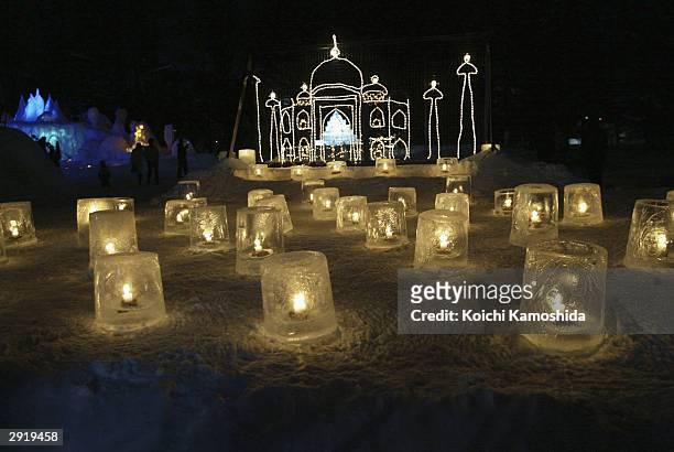 Lit candles are displayed on snow during the Asahikawa Winter Festival February 1, 2004 in Asahikawa, Japan. Most of the work done to make the...