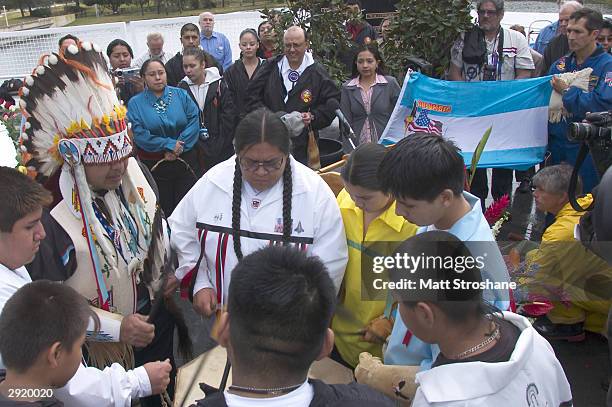 Members of the Shoshone-Bannock High School NASA club in Fort Hall, Idaho, perform a healing ceremony after a memorial ceremony for fallen astronauts...