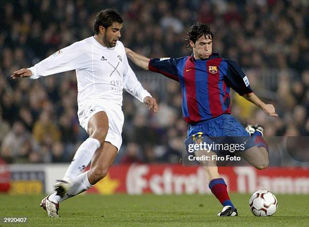 Luis Garcia of Barcelona and Buades of Albacente in action during the La Liga match between Barcelona and Albacete at the Nou Camp on February 1,...