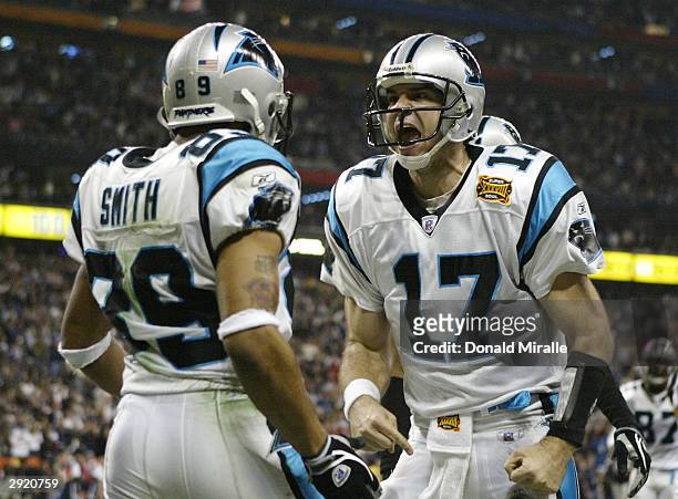 Quarterback Jake Delhomme of the Carolina Panthers celebrates with Steve Smith after Smith caught a 5-yard touchdown pass in the second quarter...