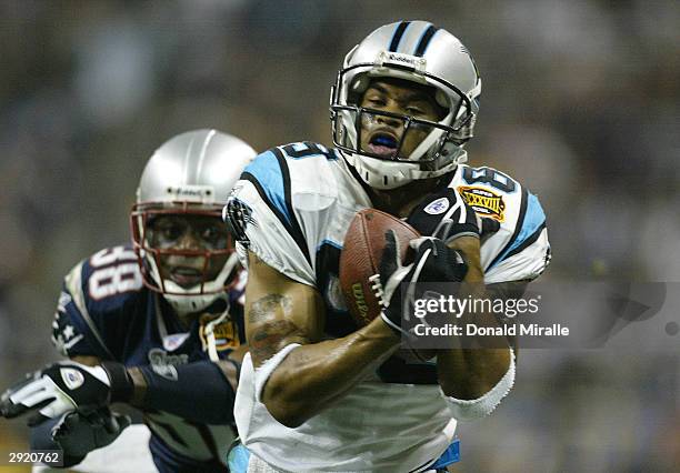 Wide receiver Steve Smith of the Carolina Panthers catches a 39-yard touchdown pass on corner Tyrone Poole of the New England Patriots in the second...