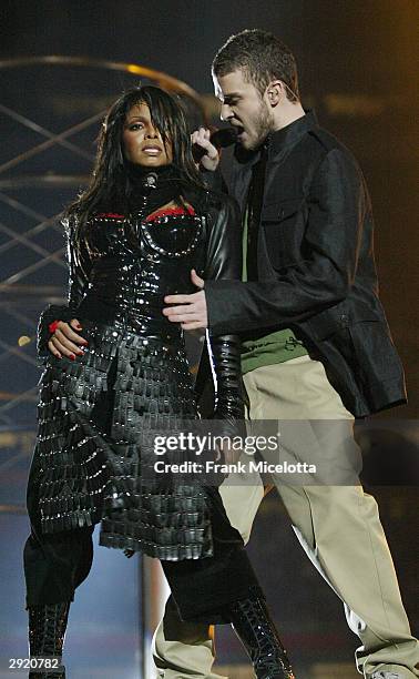 Singers Janet Jackson and surprise guest Justin Timberlake perform during the halftime show at Super Bowl XXXVIII between the New England Patriots...