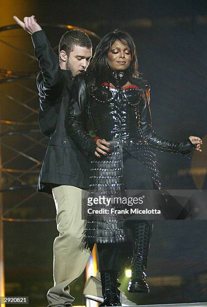 Singers Janet Jackson and surprise guest Justin Timberlake perform during the halftime show at Super Bowl XXXVIII between the New England Patriots...