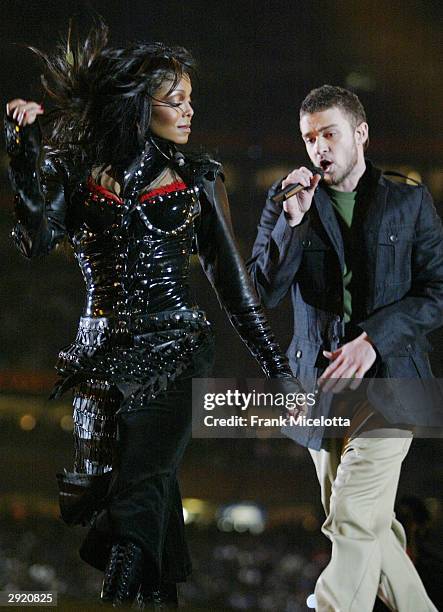 Singers Janet Jackson and surprise guest Justin Timberlake perform during the halftime show at Super Bowl XXXVIII between the New England Patriots...