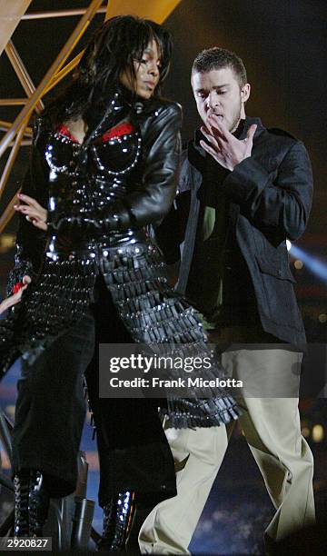 Singers Janet Jackson and surprise guest Justin Timberlake perform during the halftime show at Super Bowl XXXVIII between the New England Patriots...