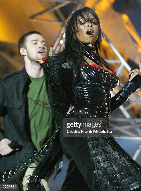 Singers Janet Jackson and surprise guest Justin Timberlake perform during the halftime show at Super Bowl XXXVIII between the New England Patriots...