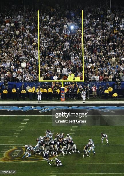 Place kicker Adam Vinatieri of the New England Patriots kicks the game winning field goal in the fourth quarter against the Carolina Panthers during...