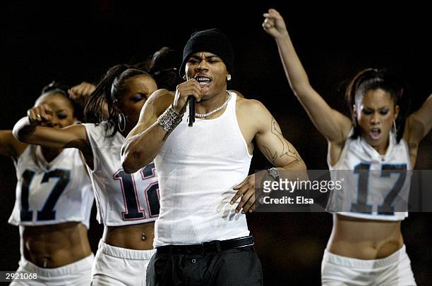 Nelly performs during the halftime show at Super Bowl XXXVIII between the New England Patriots and the Carolina Panthers at Reliant Stadium on...