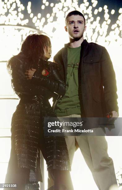 Singers Janet Jackson and surprise guest Justin Timberlake perform during the halftime show at Super Bowl XXXVIII between the New England Patriots...