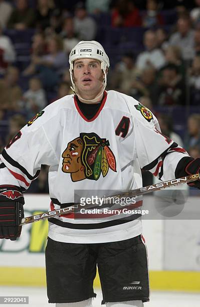 Kyle Calder of the Chicago Blackhawks looks on during a break in game action against the Phoenix Coyotes on October 28, 2003 at America West Arena in...