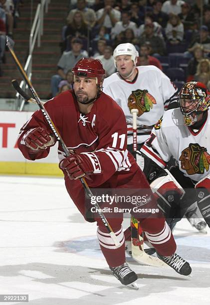 Daymond Langkow of the Phoenix Coyotes skates after the puck during the game against the Chicago Blackhawks on October 28, 2003 at America West Arena...