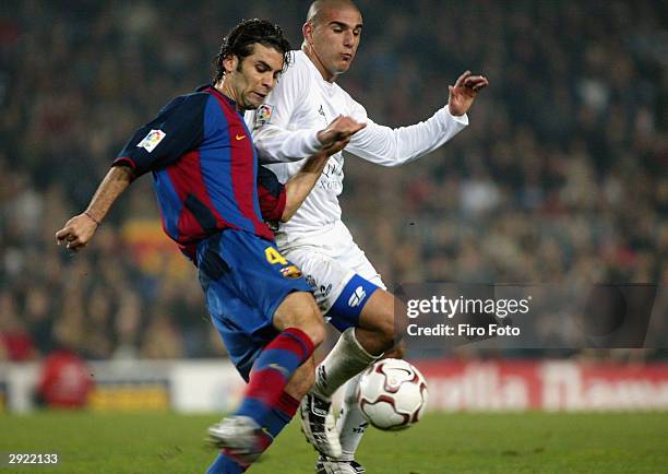 Rafael Marquez of Barcelona battles with Carlos Aranda of Albacete during the La Liga match between FC Barcelona and Albacete played at the Nou Camp...