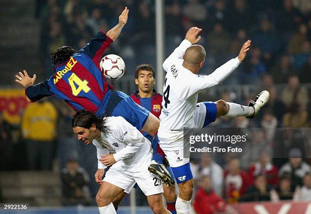 Rafael Marquez of Barcelona clashes with Antonio Pacheco and Carlos Aranda of Albacete during the La Liga match between FC Barcelona and Albacete...