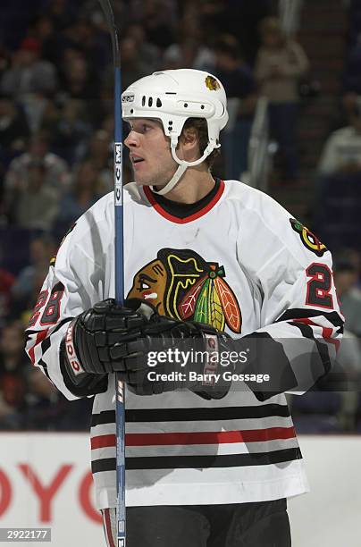 Mark Bell of the Chicago Blackhawks gets ready for play to resume during the game against the Phoenix Coyotes on October 28, 2003 at America West...