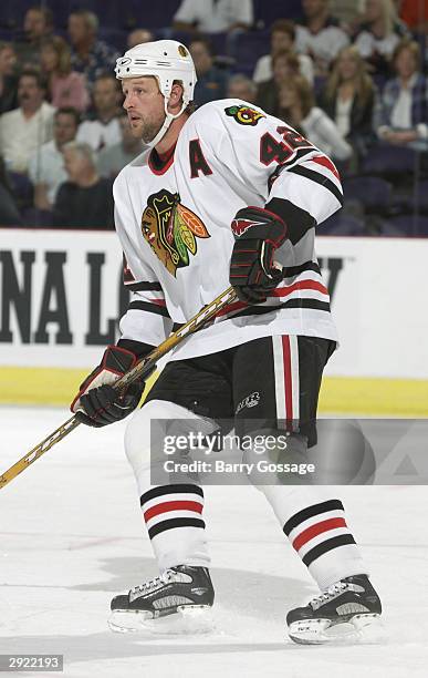 Jon Klemm of the Chicago Blackhawks defends against the Phoenix Coyotes on October 28, 2003 at America West Arena in Phoenix, Arizona. The Blackhawks...