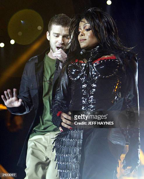Singers Janet Jackson and Justin Timberlake perform during the half-time show of Super Bowl XXXVIII at Reliant Stadium 01 February 2004 in Houston,...