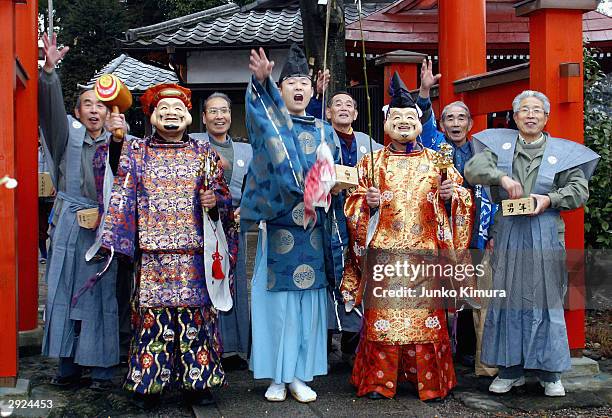 Men, dressed as the gods Ebisu and Daikoku throw beans outside a shrine in the area of Kamikagemori as part of the celebrations for Setsubun or the...