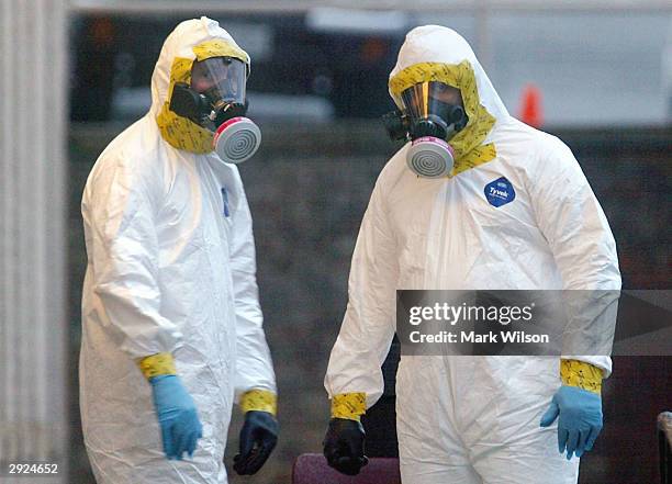 Members of the U.S. Capitol Police HAZMAT Team prepare to search through an Escalade SUV used by U.S. Senate Majority Leader and U.S. Senator Bill...