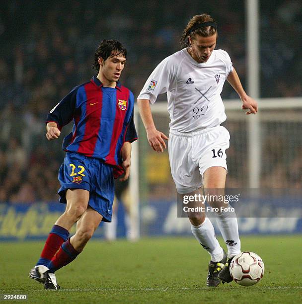 David Garc�a of Albacete and Luis Garcia of Barcelona in action during the La Liga match between FC Barcelona and Albacete played at the Nou Camp...