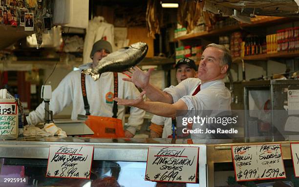 Democratic presidential candidate and former Vermont Governor Howard Dean prepares to catch a King Salmon that was tossed to him during a campaign...