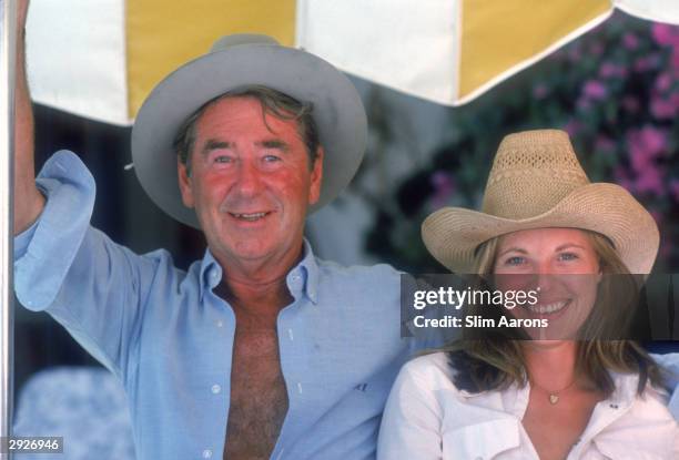 Photographer Slim Aarons with Anne Klehe in Sotogrande, Spain, September 1975.