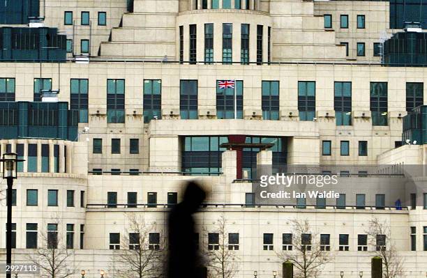 Pedestrian walks past the Secret Intelligence Service headquarters February 4, 2004 in London. A new inquiry is to be launched which will investigate...