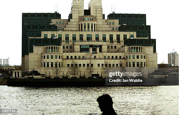 Pedestrian walks past the Secret Intelligence Service headquarters February 4, 2004 in London. A new inquiry is to be launched which will investigate...