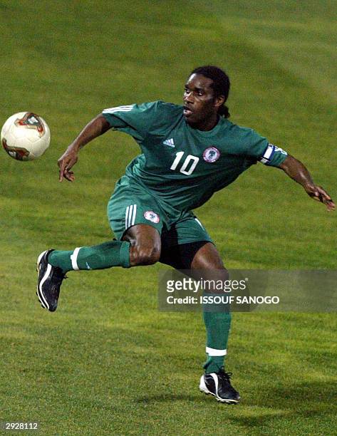 Nigerian forward Jay Jay Okocha in action 04 February 2004 in Sfax, during their African Nations Cup match against Benin. AFP PHOTO ISSOUF SANOGO