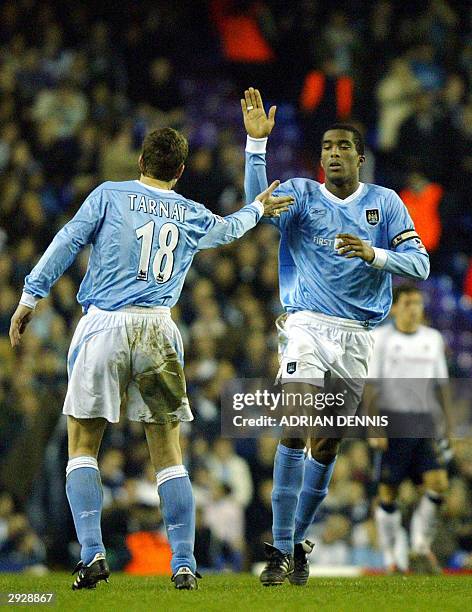 Manchester City's captain Sylvain Distin celebrates scoring a goal with Michael Tarnat against Tottenham Hotspur during the F.A. Cup 4th Round Replay...