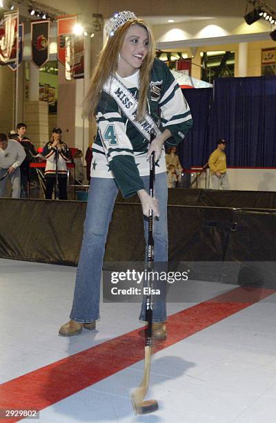 Jessica Dereschuk, reigning Miss Minnesota, takes a shot in the Shoot and Score game at the NHL FANtasy during the NHL All-Star Weekend on February...