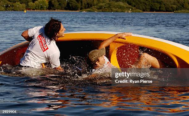 Brendan Fevola and Matthew Lappin of the Blues capsize their canoe during the Carlton Football Club Community Camp , February 5, 2004 in Ballarat,...