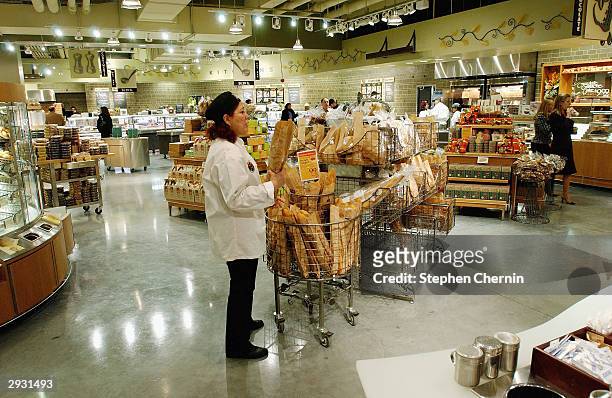 Clerks prepares the bread department as Whole Foods Market readies for its opening February 5, 2004 in New York City. The market, located at the...