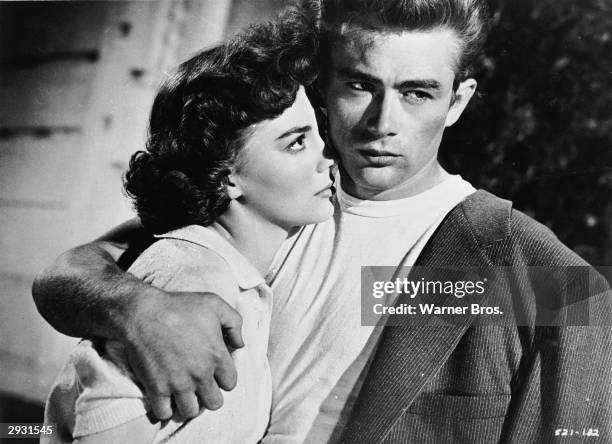 American actor James Dean holds American actor Natalie Wood in a scene from 'Rebel Without A Cause,' directed by Nicholas Ray, 1955.