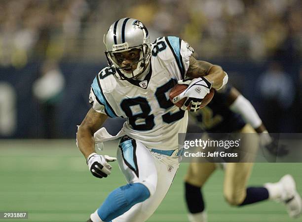 Wide receiver Steve Smith of the Carolina Panthers runs with the ball during the NFC Divisional Playoff game against the St. Louis Rams on January...