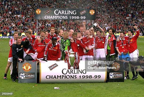 The Manchester United team celebrate on the pitch having won the title after the FA Carling Premiership match between Manchester United v Tottenham...