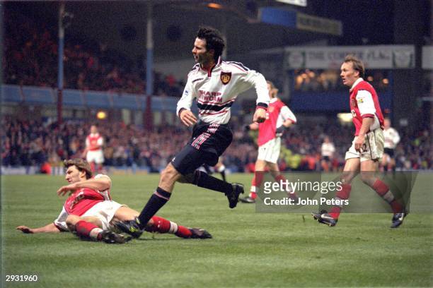 Ryan Giggs of Manchester United scores the winning goal for Manchester United in extra time during the FA Cup semi-final between Arsenal v Manchester...