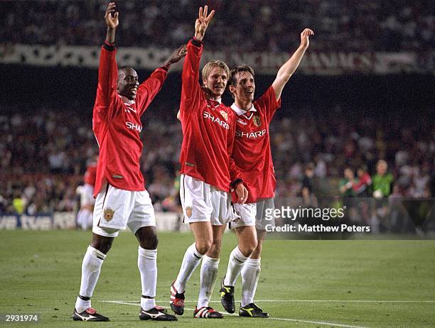 Dwight Yorke, David Beckham and Gary Neville celebrate after the UEFA Champions League Final between Bayern Munich v Manchester United at the Nou...