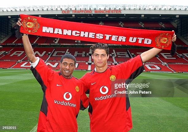 Kleberson and Cristiano Ronaldo pose for photographers on the pitch at Old Trafford on August 13, 2003 in Manchester, England.