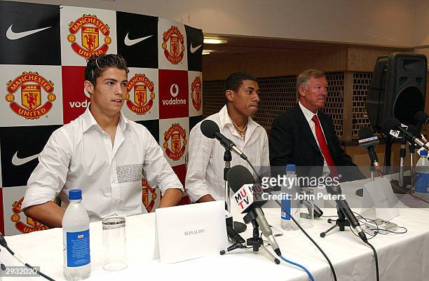 Cristiano Ronaldo, Kleberson and Sir Alex Ferguson during the Press Conference at the players official signing at Old Trafford on August 13, 2003 in...