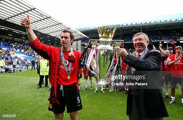 Laurent Blanc and manager Sir Alex Ferguson celebrate with the Barclaycard Premiership trophy after the FA Barclaycard Premiership match between...