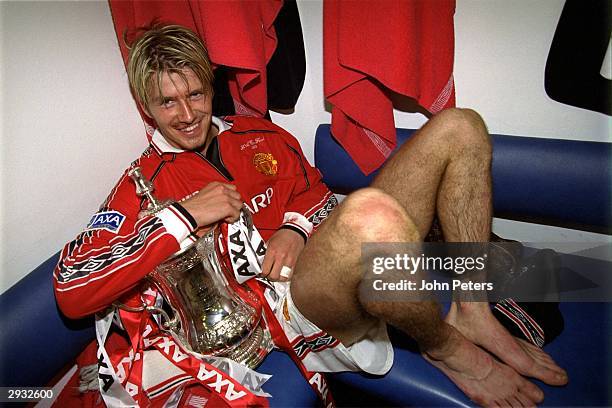 David Beckham in the dressing room with the FA Cup after the FA Cup Final between Manchester United v Newcastle at Wembley Stadium on May 22, 1999 in...