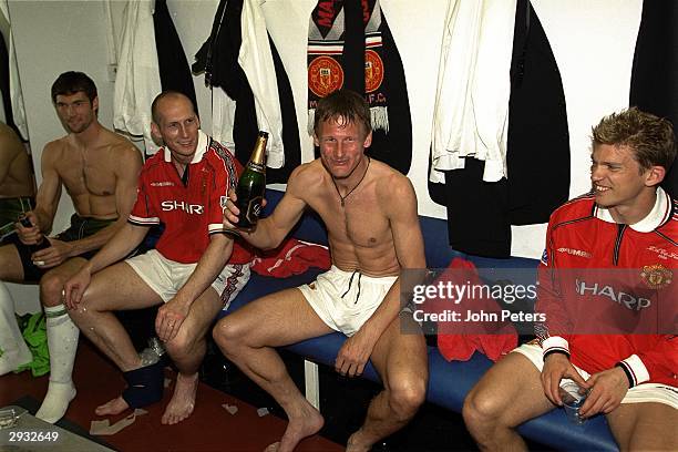 Teddy Sheringham celebrates in the dressing room after the FA Cup Final between Manchester United v Newcastle at Wembley Stadium on May 22, 1999 in...