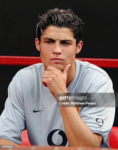 New signing Cristiano Ronaldo lokks on from the bench during the FA Barclaycard Premiership match between Manchester United v Bolton Wanderers at Old...