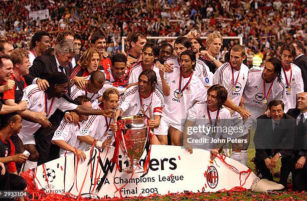 The AC Milan team celebrate winning the Champions League Final during the UEFA Champions League Final match between AC Milan v Juventus FC at Old...