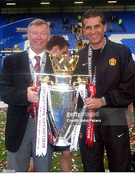 Sir Alex Ferguson and Carlos Queiroz celebrate with the Premier League Trophy after the FA Barclaycard Premiership match between Everton v Manchester...
