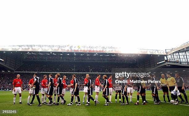 The Manchester United and Real Madrid players shake hands prior to the UEFA Champions League Quarter Final, Second Leg match between Manchester...